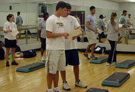 Student interns participating in a step aerobics class
