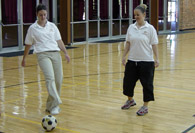 Interns passing soccer ball