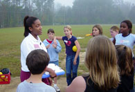 Intern teaching students on soccer field